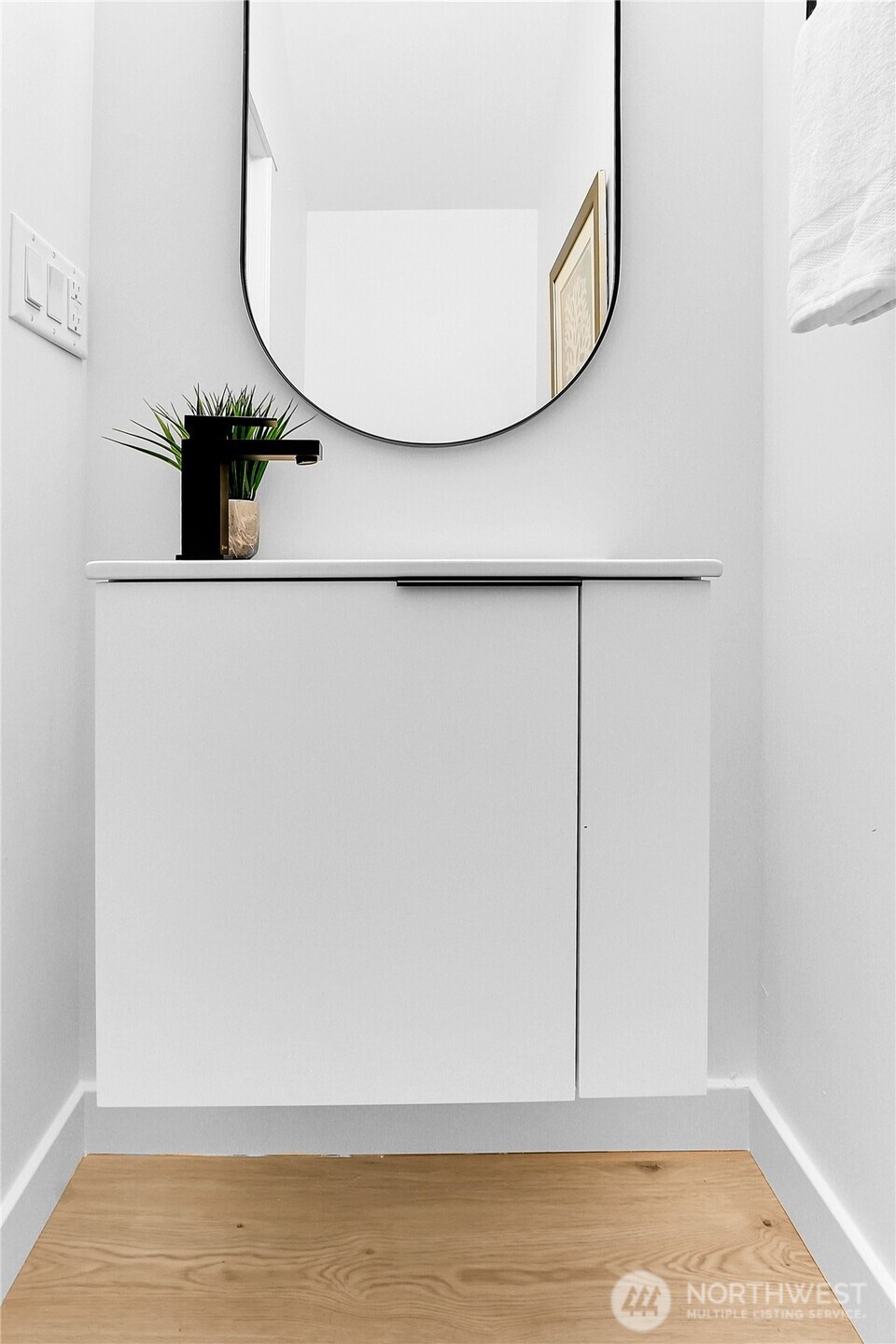 631 West Emerson Street Seattle, WA 98119 - Photo 10 of 24 a view of a livingroom with wooden floor