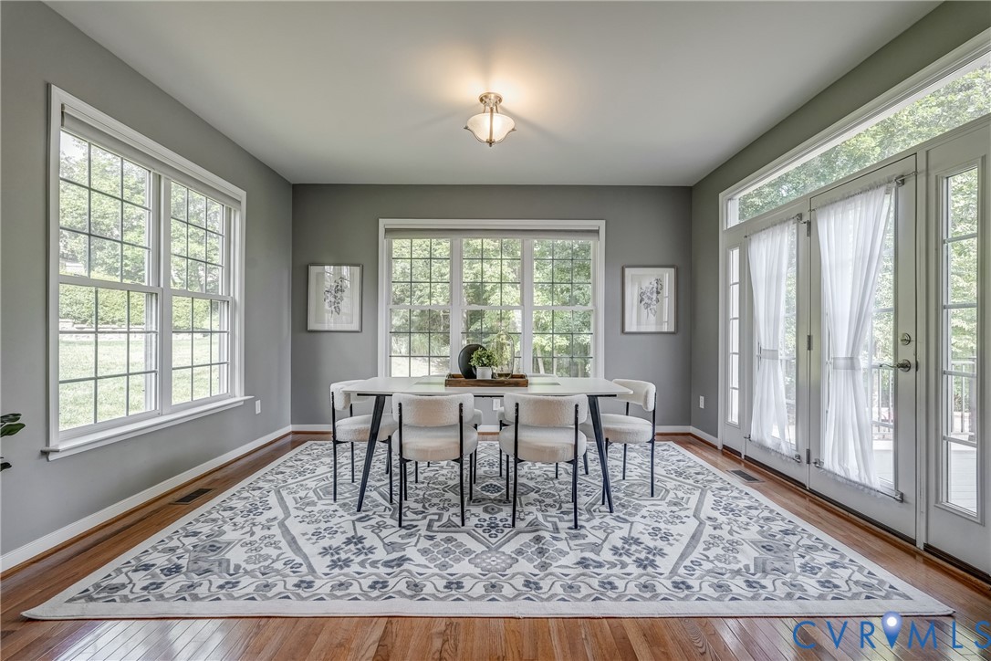 3612 Edenfield Road Midlothian, VA 23113 - Photo 16 of 50 a dining room with wooden floor table and chairs