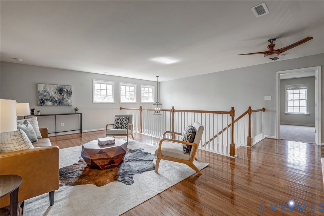 3612 Edenfield Road Midlothian, VA 23113 - Photo 33 of 50 a living room with furniture a rug potted plant and a window