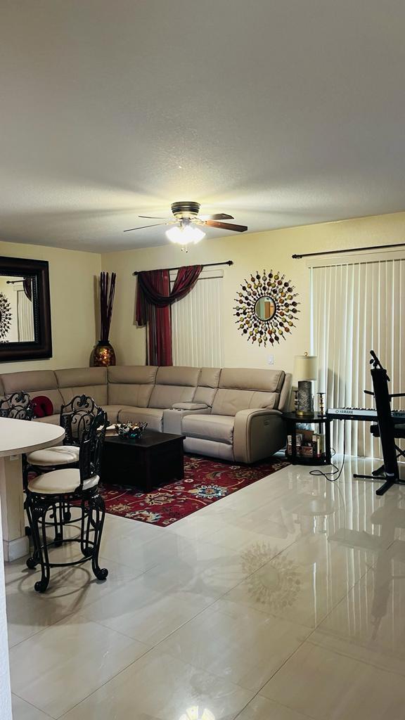 1267 Rose Gate Boulevard Riviera Beach, FL 33404 - Photo 12 of 29 a living room with furniture