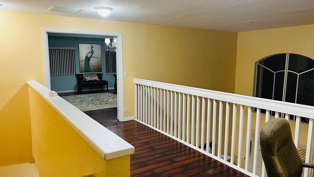 1267 Rose Gate Boulevard Riviera Beach, FL 33404 - Photo 19 of 29 a view of a living room with wooden floor