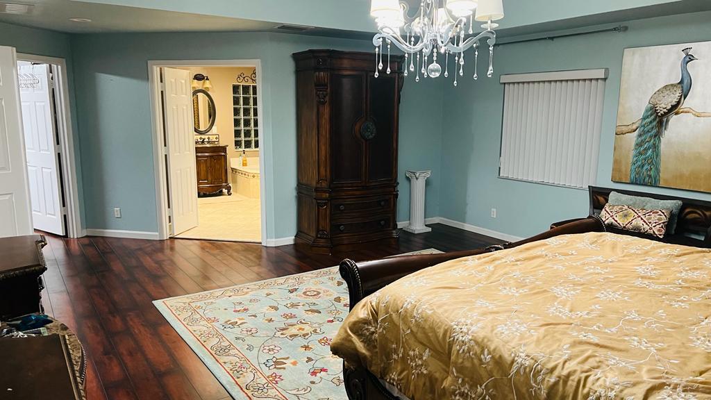 1267 Rose Gate Boulevard Riviera Beach, FL 33404 - Photo 23 of 29 a bedroom with bed and window