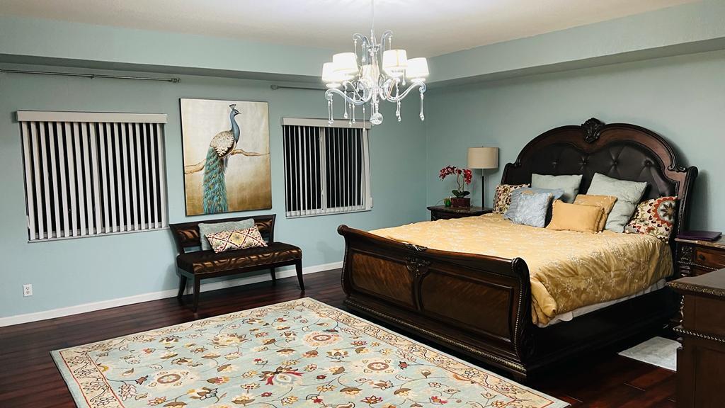 1267 Rose Gate Boulevard Riviera Beach, FL 33404 - Photo 24 of 29 a bedroom with a bed and a dresser