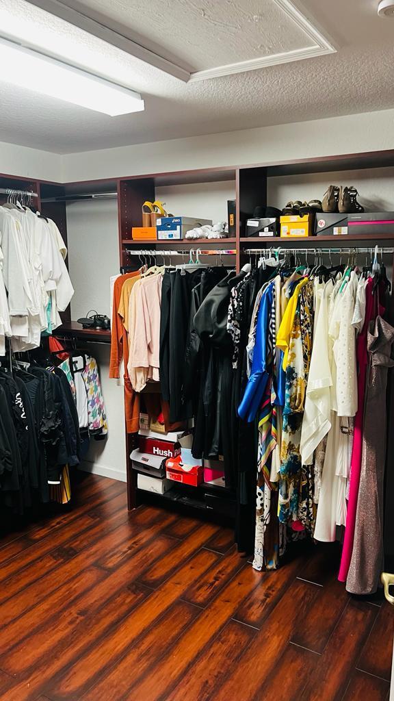 1267 Rose Gate Boulevard Riviera Beach, FL 33404 - Photo 25 of 29 a view of walk in closet with clothes and shoes