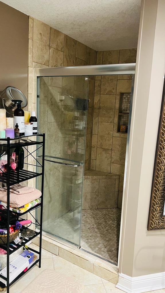 1267 Rose Gate Boulevard Riviera Beach, FL 33404 - Photo 29 of 29 a bathroom with a shower