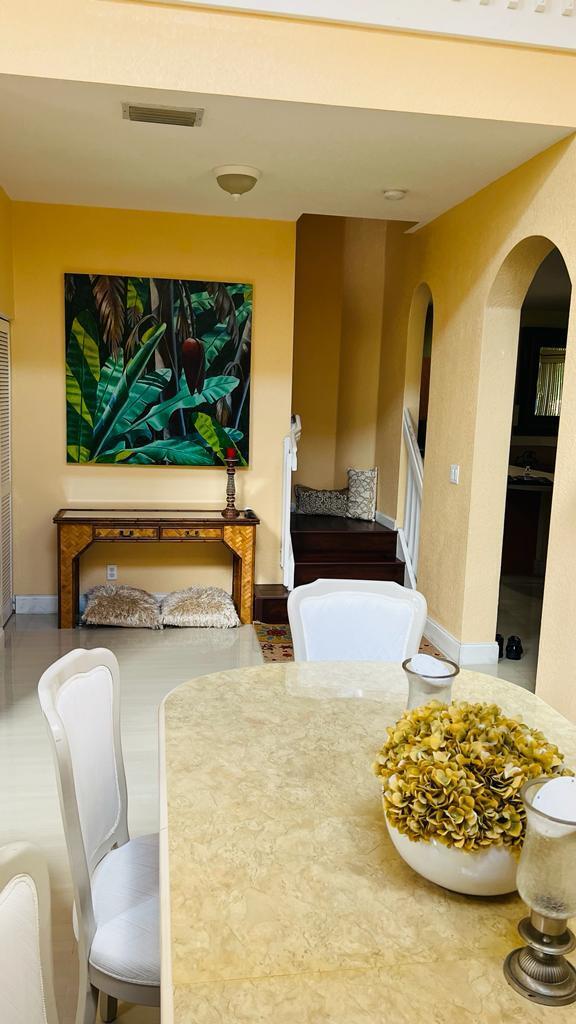 1267 Rose Gate Boulevard Riviera Beach, FL 33404 - Photo 6 of 29 a living room with a flat screen tv