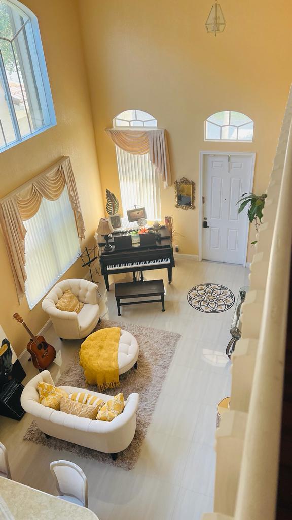 1267 Rose Gate Boulevard Riviera Beach, FL 33404 - Photo 7 of 29 a living room with furniture and a fireplace