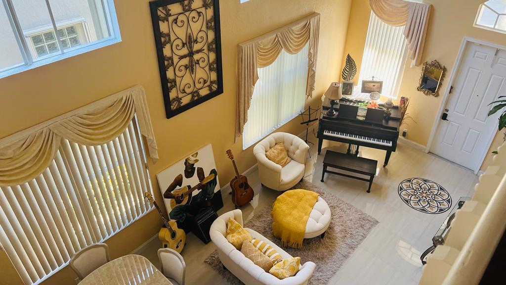 1267 Rose Gate Boulevard Riviera Beach, FL 33404 - Photo 8 of 29 a living room with furniture and a window