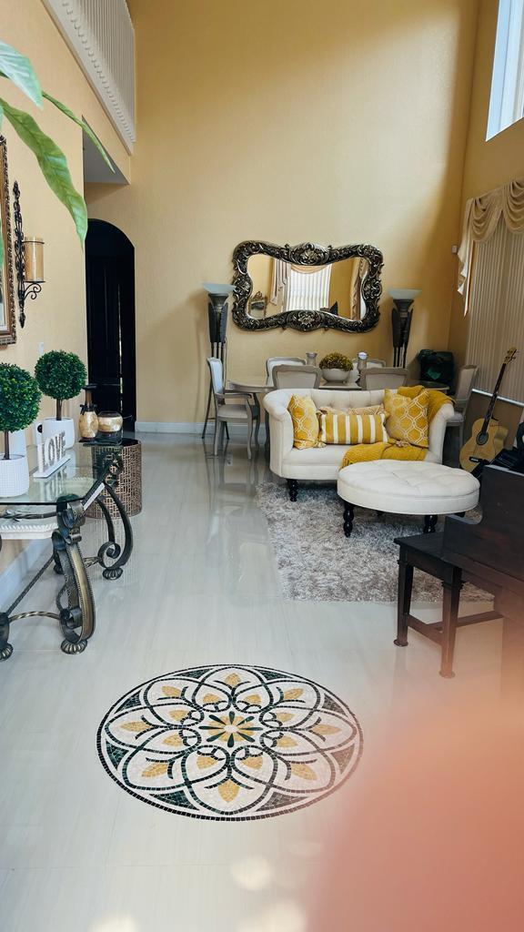 1267 Rose Gate Boulevard Riviera Beach, FL 33404 - Photo 10 of 29 a room with furniture a rug and white walls