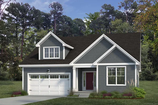 a front view of a house with a garden and trees