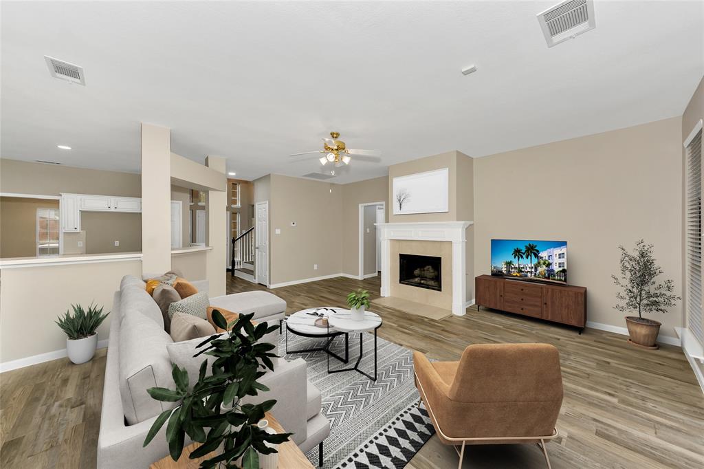 857 Summit Pointe Lewisville, TX 75077 - Photo 11 of 33 a living room with furniture fireplace and a potted plant