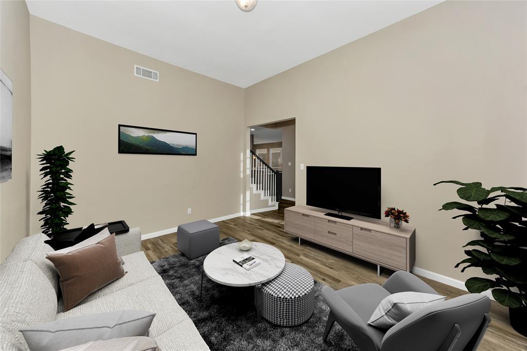 857 Summit Pointe Lewisville, TX 75077 - Photo 13 of 33 a living room with furniture and a flat screen tv