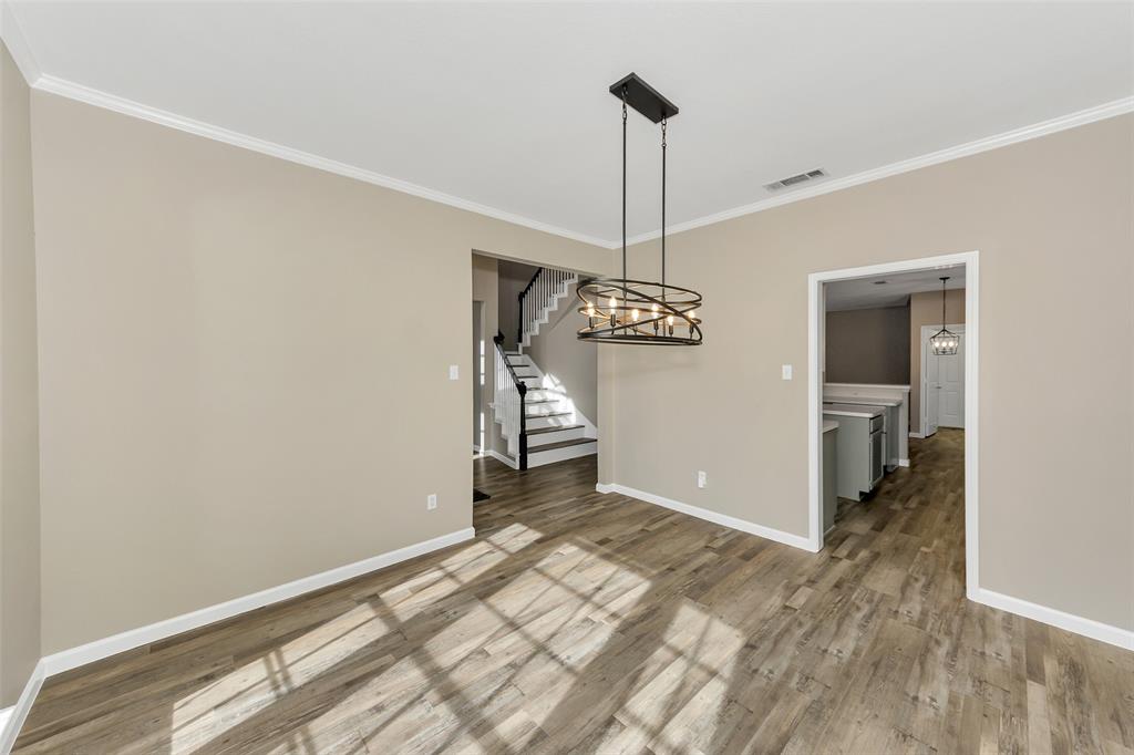 857 Summit Pointe Lewisville, TX 75077 - Photo 15 of 33 a view of a chandelier in a room