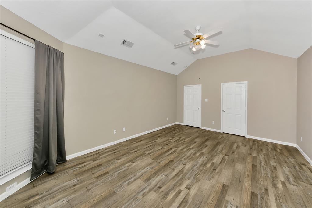 857 Summit Pointe Lewisville, TX 75077 - Photo 18 of 33 a view of a livingroom with a ceiling fan and hardwood floor