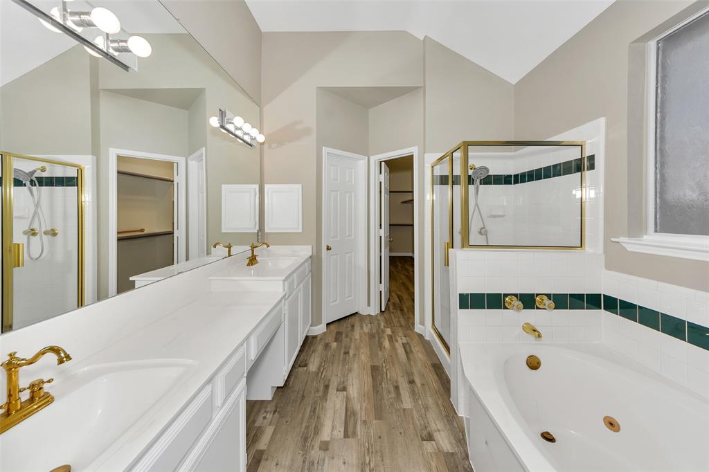 857 Summit Pointe Lewisville, TX 75077 - Photo 20 of 33 a spacious bathroom with a tub a double vanity sink and mirror