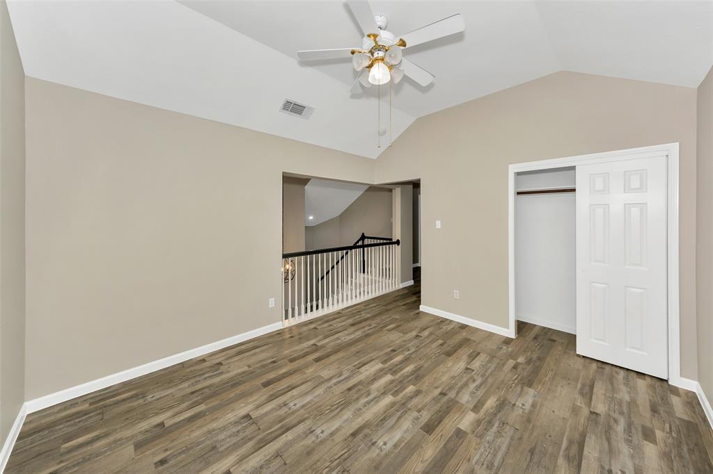 857 Summit Pointe Lewisville, TX 75077 - Photo 25 of 33 wooden floor in an empty room with a window