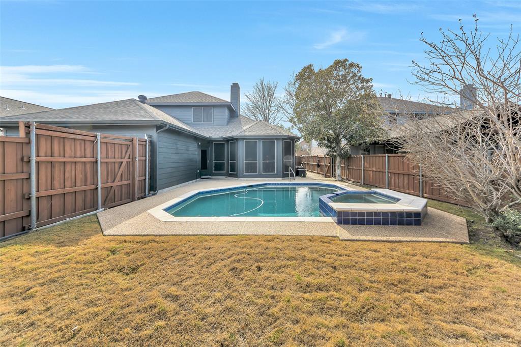 857 Summit Pointe Lewisville, TX 75077 - Photo 30 of 33 a view of a house with swimming pool and sitting area