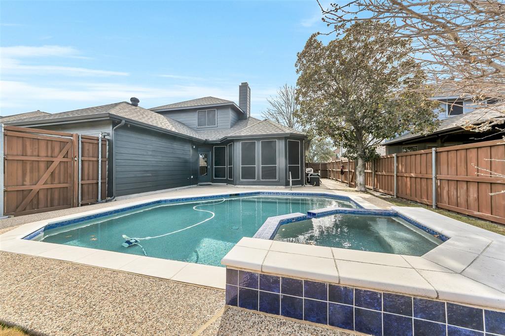 857 Summit Pointe Lewisville, TX 75077 - Photo 31 of 33 a view of a house with swimming pool