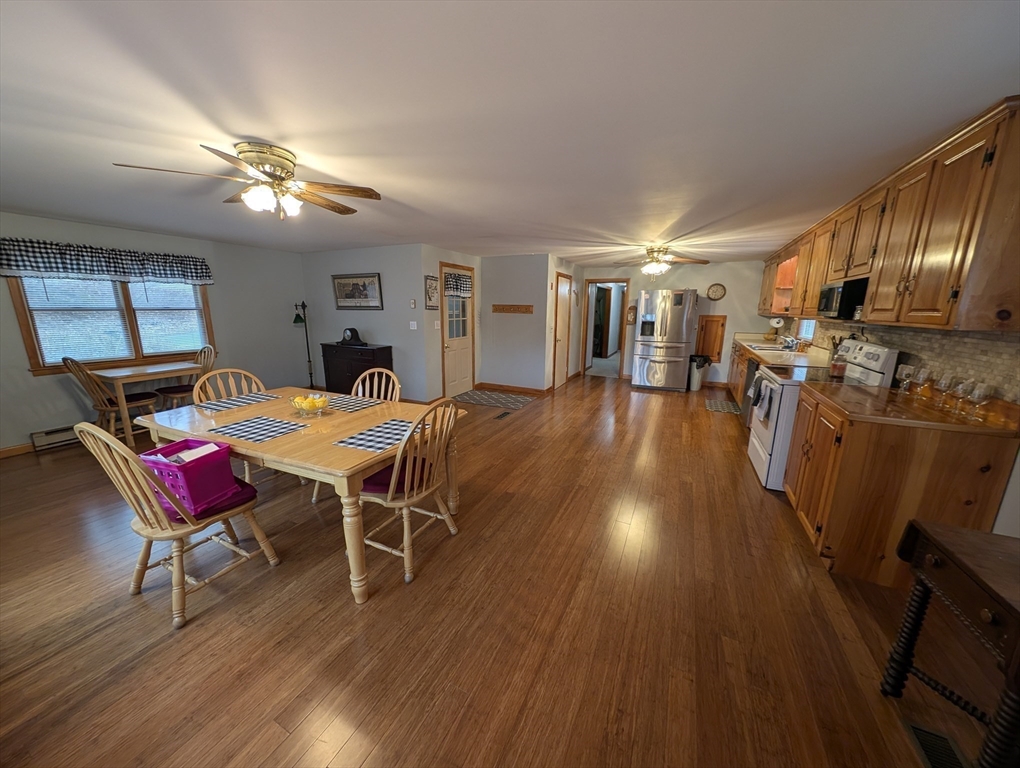 13 Brookfield Road Charlton, MA 01507 - Photo 11 of 41 a view of a dining room with furniture and wooden floor