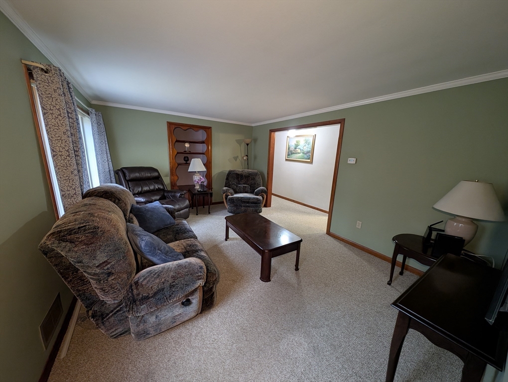 13 Brookfield Road Charlton, MA 01507 - Photo 23 of 41 a living room with furniture and a window