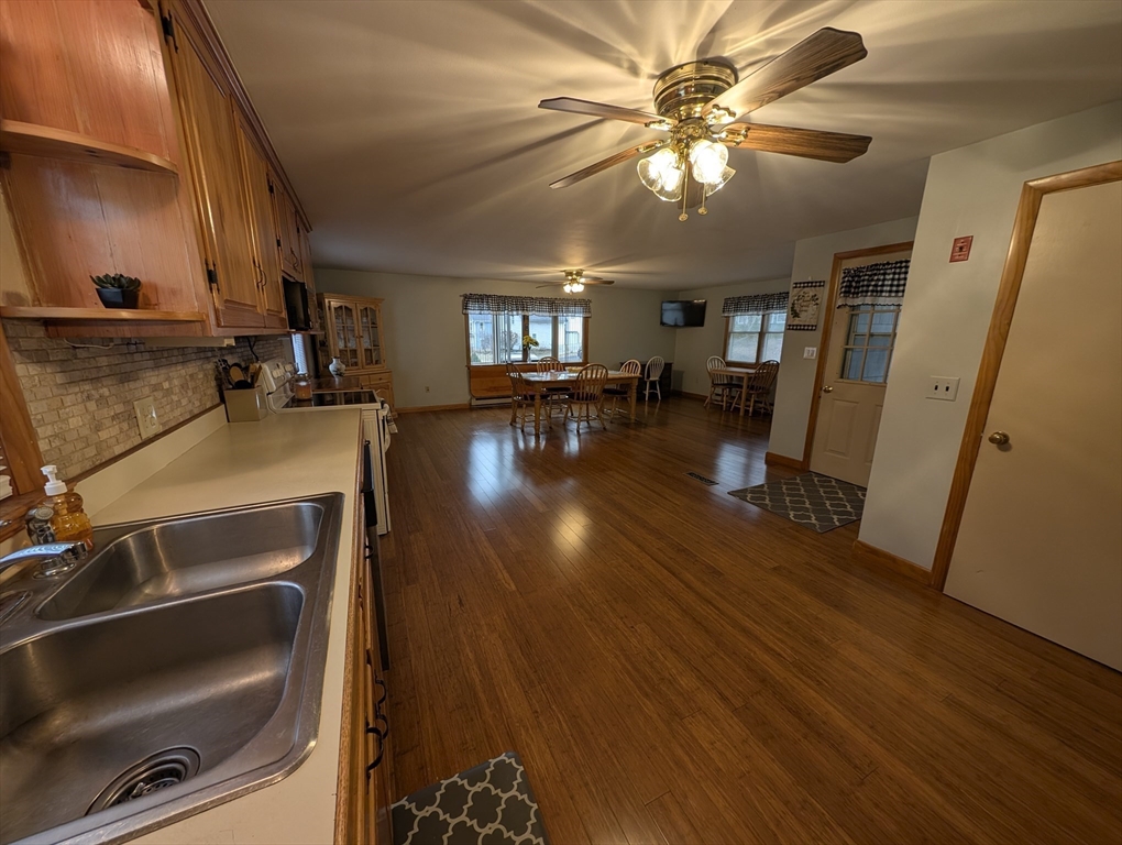 13 Brookfield Road Charlton, MA 01507 - Photo 29 of 41 a view of a livingroom with furniture hardwood floor and a ceiling fan