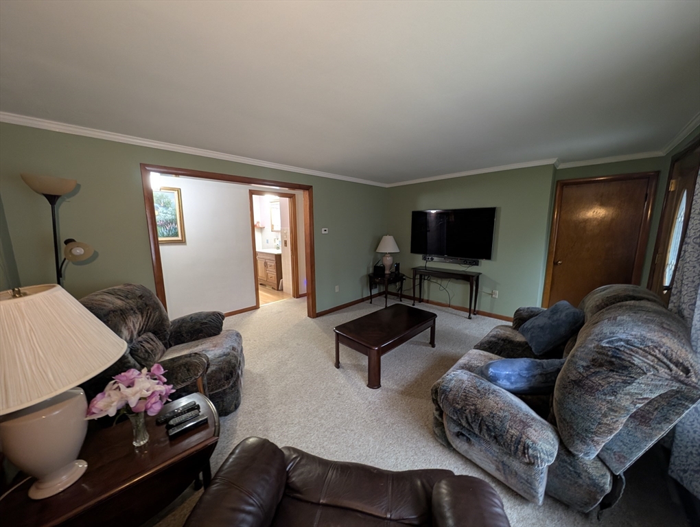 13 Brookfield Road Charlton, MA 01507 - Photo 37 of 41 a living room with furniture and a flat screen tv