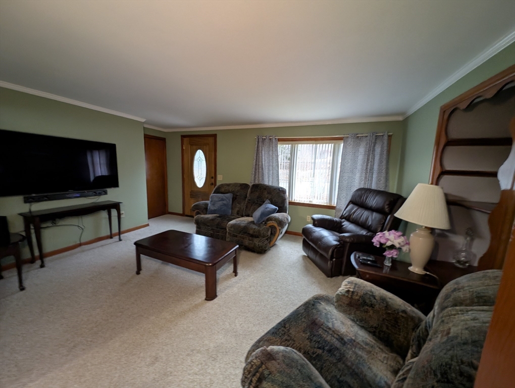 13 Brookfield Road Charlton, MA 01507 - Photo 5 of 41 a living room with furniture and a flat screen tv