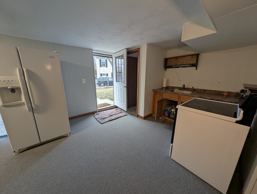 13 Brookfield Road Charlton, MA 01507 - Photo 6 of 41 a view of a kitchen with fridge and a sink