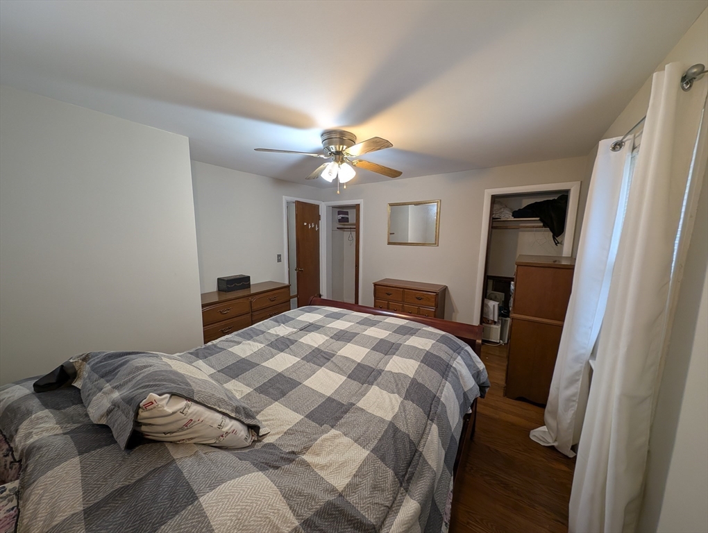 13 Brookfield Road Charlton, MA 01507 - Photo 9 of 41 a bedroom with a bed and a chandelier
