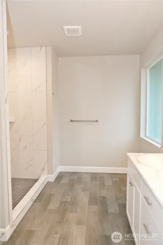 a view of storage and utility room with closet