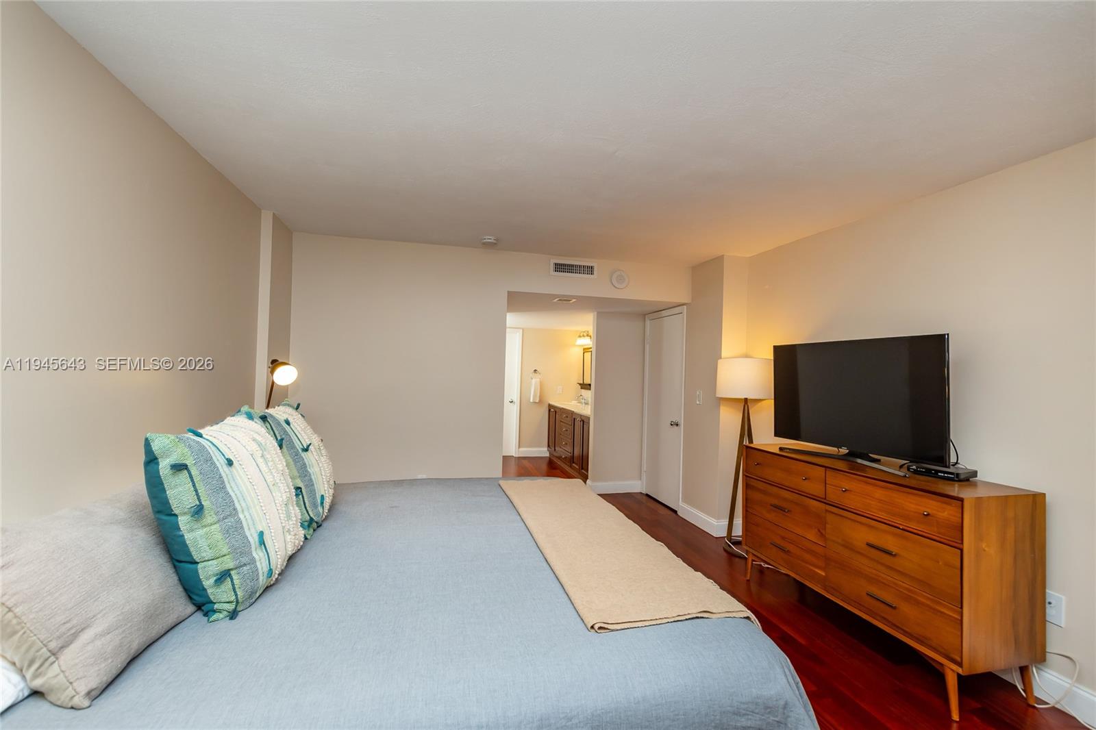 199 Ocean Ln Drive, Unit 807 Key Biscayne, FL 33149 - Photo 5 of 34 a living room with furniture and a flat screen tv