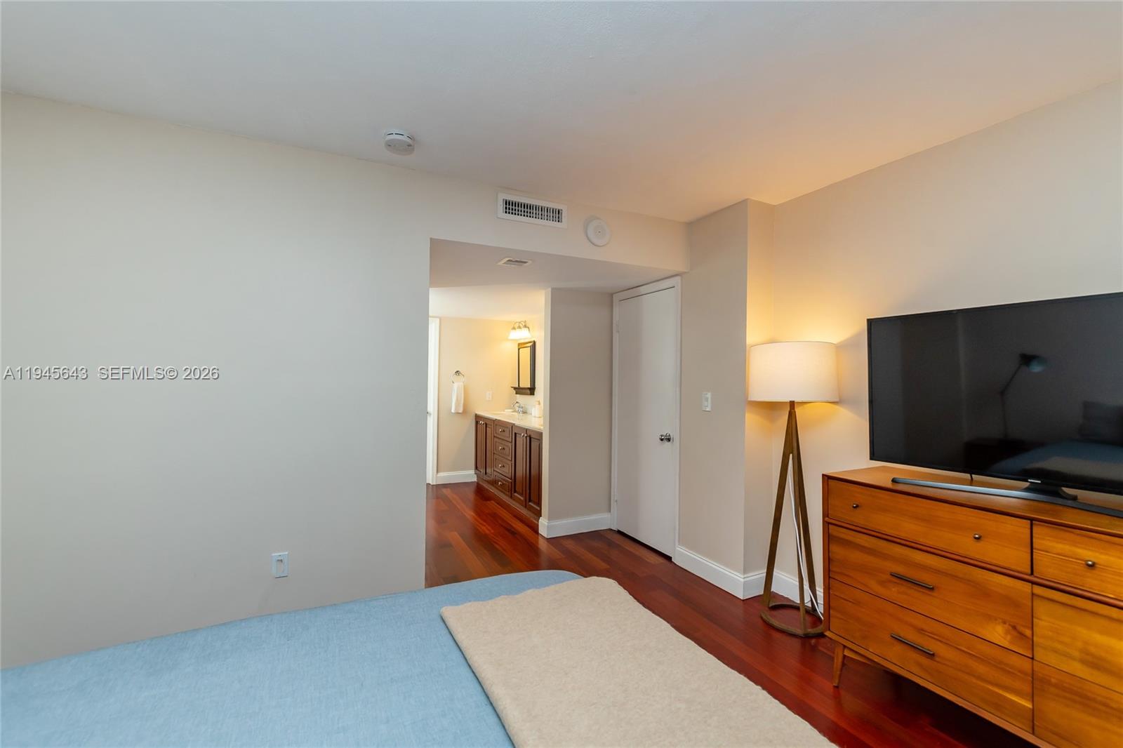 199 Ocean Ln Drive, Unit 807 Key Biscayne, FL 33149 - Photo 6 of 34 a living room with furniture and flat screen tv