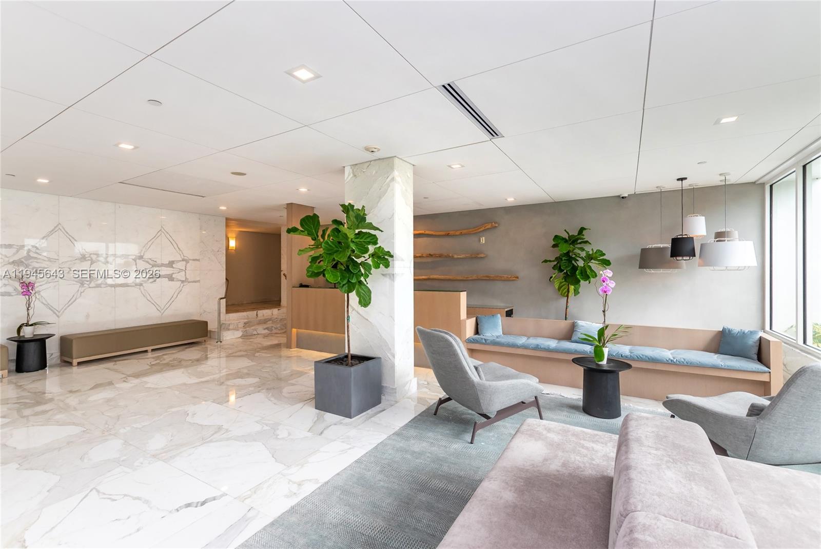 199 Ocean Ln Drive, Unit 807 Key Biscayne, FL 33149 - Photo 8 of 34 a living room with furniture and a potted plant