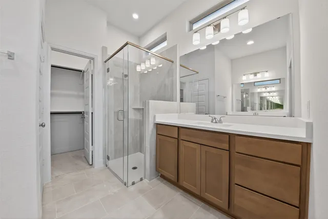 a bathroom with a double vanity sink and a mirror