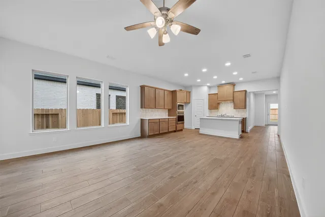 a view of kitchen with wooden floor and window