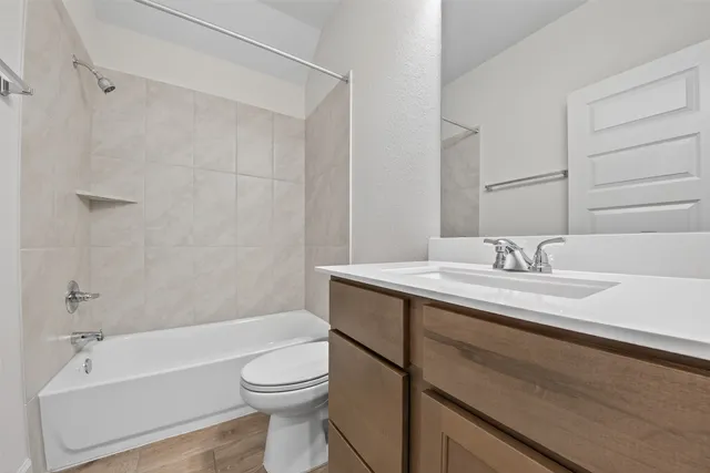 a large kitchen with kitchen island a sink stainless steel appliances and cabinets