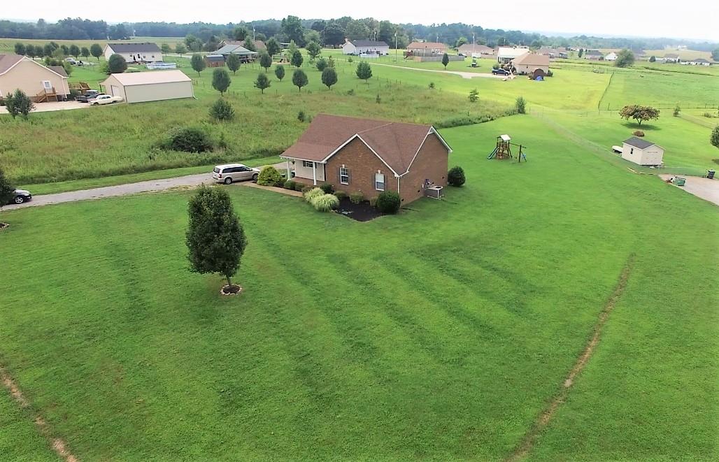 127 Old Martin Chapel Road Portland, TN 37148 - Photo 3 of 15 an aerial view of a house with pool big yard and large trees