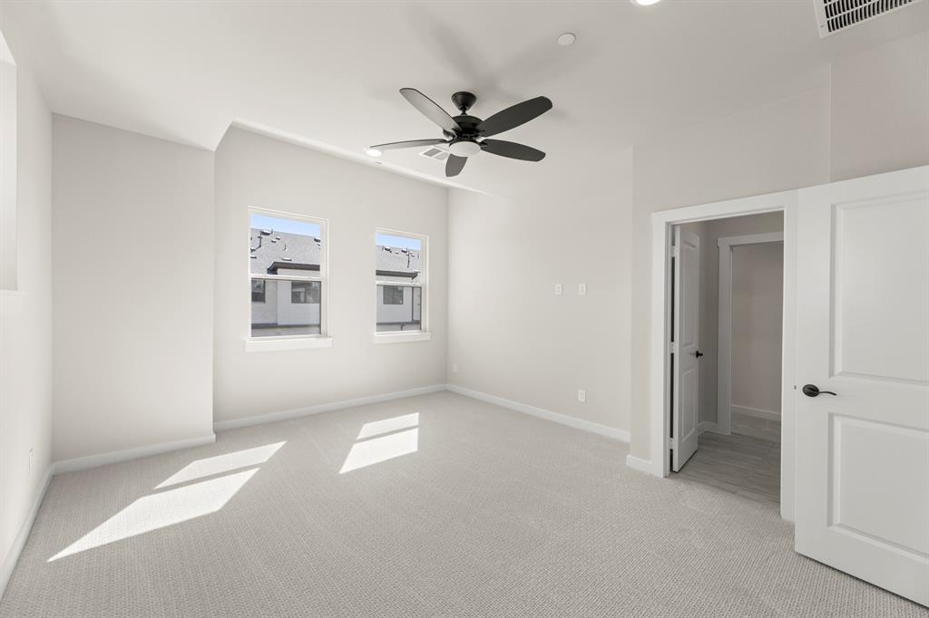 2001 Aldrich Road Celina, TX 75009 - Photo 26 of 37 an empty room with windows and fan