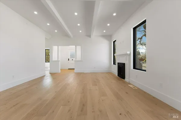 a large kitchen with stainless steel appliances granite countertop a stove and a sink