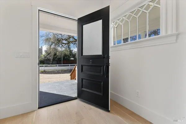 a view of a living room with a large window
