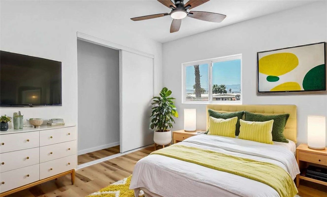 73250 Colonial Drive Thousand Palms, CA 92276 - Photo 12 of 18 a bedroom with a bed and flat screen tv