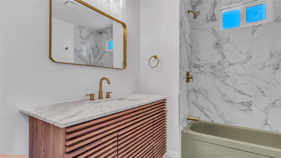 73250 Colonial Drive Thousand Palms, CA 92276 - Photo 13 of 18 a bathroom with a sink and a bathtub
