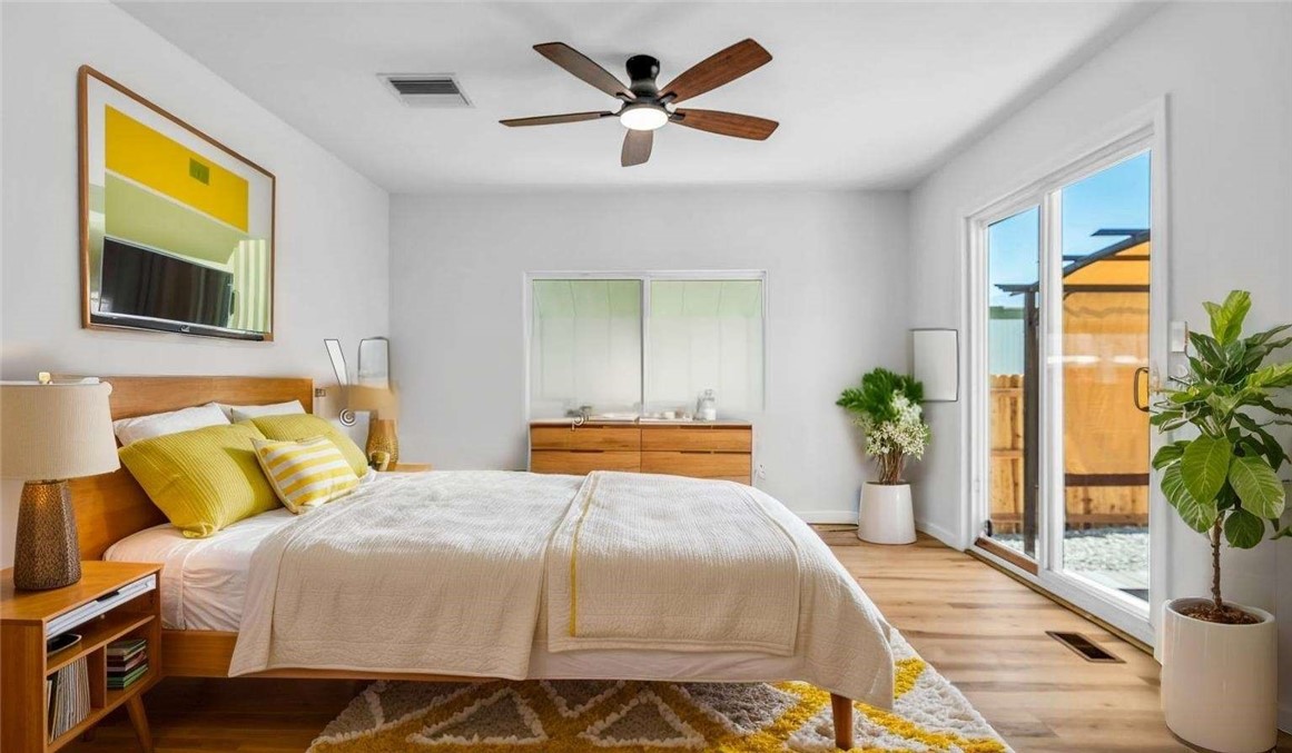 73250 Colonial Drive Thousand Palms, CA 92276 - Photo 14 of 18 a bedroom with a bed and a potted plant