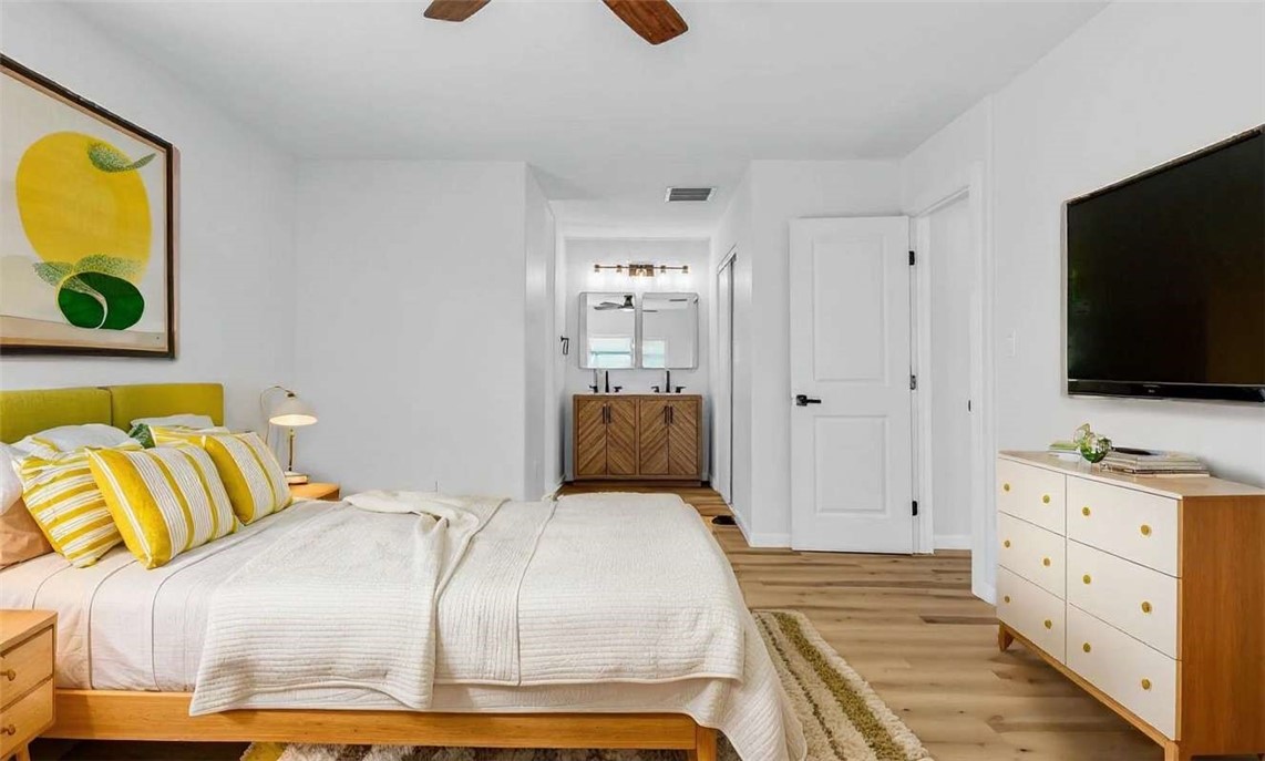 73250 Colonial Drive Thousand Palms, CA 92276 - Photo 15 of 18 a bedroom with a bed and flat screen tv