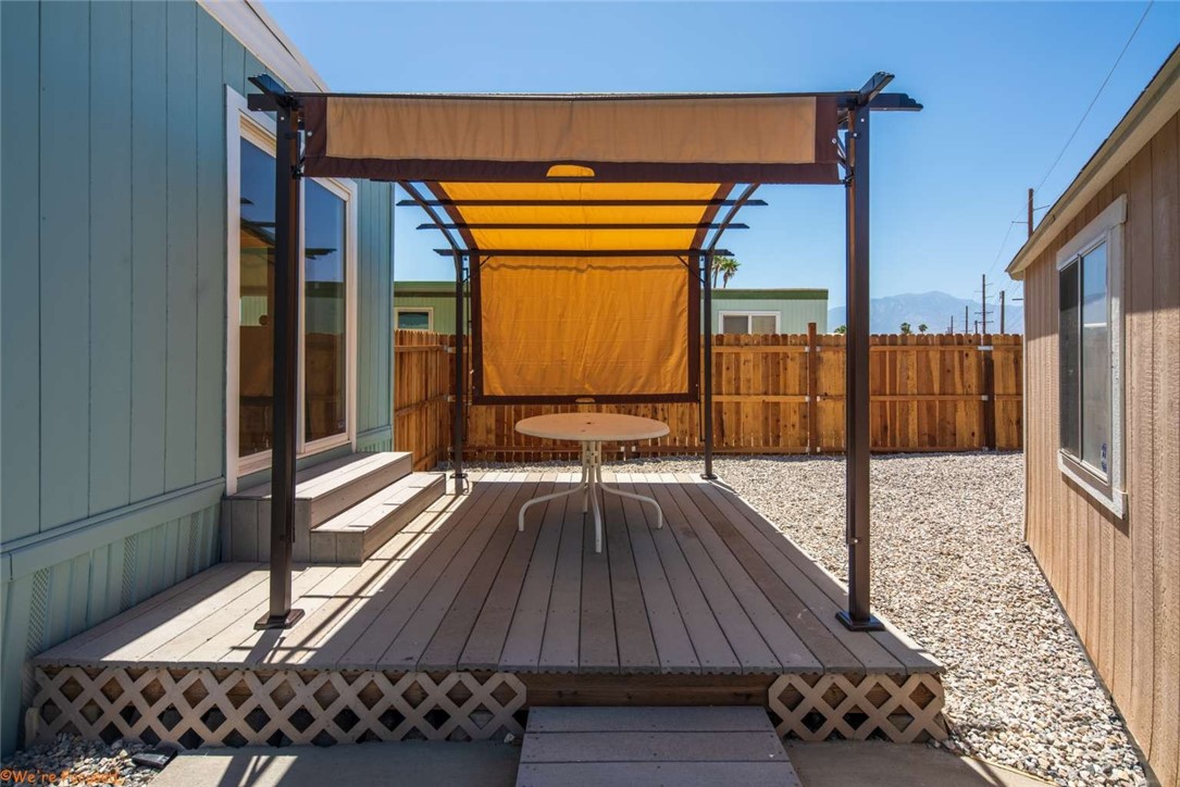 73250 Colonial Drive Thousand Palms, CA 92276 - Photo 17 of 18 a view of balcony with wooden floor and bench