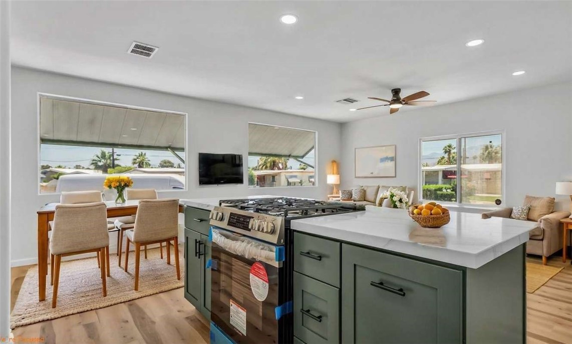 73250 Colonial Drive Thousand Palms, CA 92276 - Photo 9 of 18 a kitchen with a stove and a refrigerator
