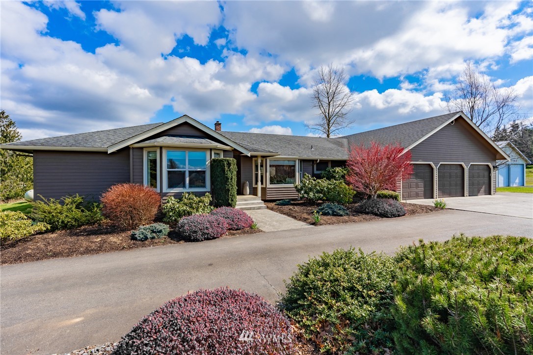5434 Noon Road Bellingham, WA 98226 - Photo 1 of 40 a front view of a house with garden