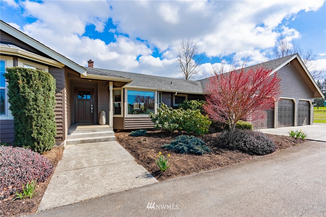 5434 Noon Road Bellingham, WA 98226 - Photo 2 of 40 a view of a house with a garden