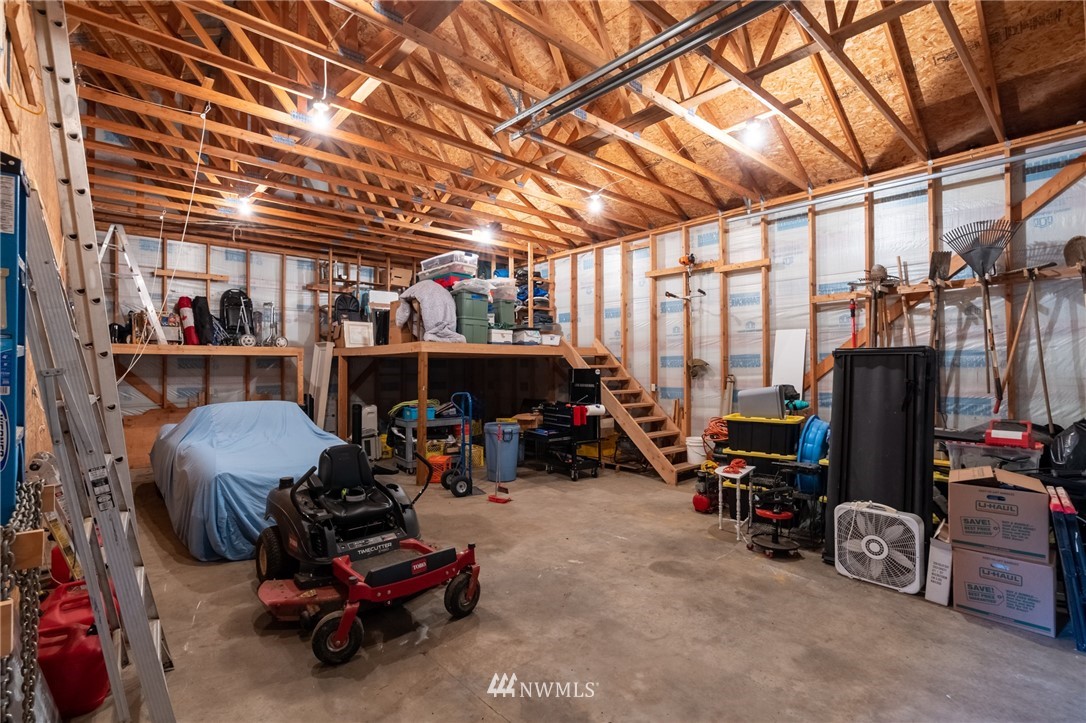5434 Noon Road Bellingham, WA 98226 - Photo 14 of 40 a view of a storage room with furniture fridge and windows
