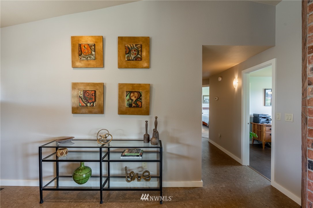 5434 Noon Road Bellingham, WA 98226 - Photo 18 of 40 a view of a hallway with paintings on the wall